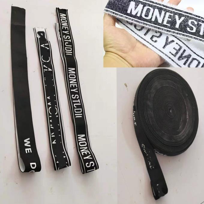 Niedriges GROSSHANDELSMOQ fertigte weißes Logo des Jacquardwebstuhls für schwarzes elastisches Haarkopf-Verpackungsband besonders an
